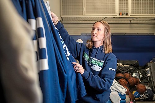 BROOK JONES / FREE PRESS
Thirty-six-year-old Carrissa Reyes is a volunteer coach with the 7-8 coed South Winnipeg Trailblazers basketball team that plays in the Winnipeg Minor Basketball Association community league. Reyes who is also a volunteer director on the board of the WMBA is pictured organizing basketball team jerseys in a basketball storage room at the South Winnipeg Community Centre Waverley Site in Winnipeg, Man., Monday, Sept. 16, 2024.