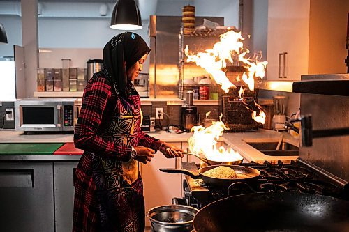 MIKAELA MACKENZIE / WINNIPEG FREE PRESS

Ganiyat Oyesomi-Daibu cooks at Wang Dao Bistro in Morden on Wednesday, Sept. 11, 2024. 

For AV story.
Winnipeg Free Press 2024