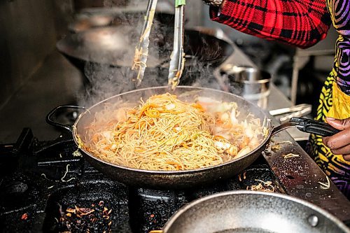 MIKAELA MACKENZIE / WINNIPEG FREE PRESS

Ganiyat Oyesomi-Daibu makes spicy Sichuan fried noodles at Wang Dao Bistro in Morden on Wednesday, Sept. 11, 2024. 

For AV story.
Winnipeg Free Press 2024