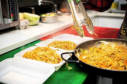 MIKAELA MACKENZIE / WINNIPEG FREE PRESS

Ganiyat Oyesomi-Daibu makes spicy Sichuan fried noodles with shrimp at Wang Dao Bistro in Morden on Wednesday, Sept. 11, 2024. 

For AV story.
Winnipeg Free Press 2024