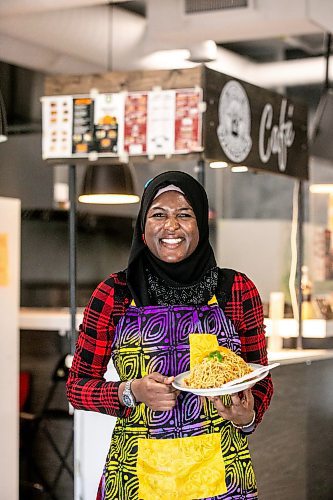 MIKAELA MACKENZIE / WINNIPEG FREE PRESS

Ganiyat Oyesomi-Daibu with spicy Sichuan fried noodles at Wang Dao Bistro in Morden on Wednesday, Sept. 11, 2024. 

For AV story.
Winnipeg Free Press 2024