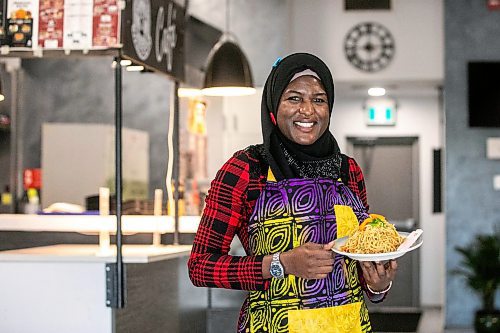 MIKAELA MACKENZIE / WINNIPEG FREE PRESS

Ganiyat Oyesomi-Daibu with spicy Sichuan fried noodles at Wang Dao Bistro in Morden on Wednesday, Sept. 11, 2024. 

For AV story.
Winnipeg Free Press 2024