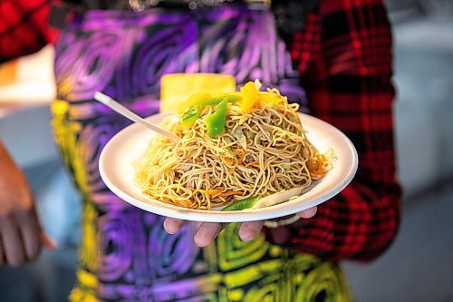 MIKAELA MACKENZIE / WINNIPEG FREE PRESS

Ganiyat Oyesomi-Daibu with spicy Sichuan fried noodles at Wang Dao Bistro in Morden on Wednesday, Sept. 11, 2024. 

For AV story.
Winnipeg Free Press 2024