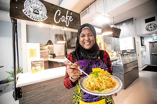 MIKAELA MACKENZIE / WINNIPEG FREE PRESS

Ganiyat Oyesomi-Daibu with spicy Sichuan fried noodles at Wang Dao Bistro in Morden on Wednesday, Sept. 11, 2024. 

For AV story.
Winnipeg Free Press 2024