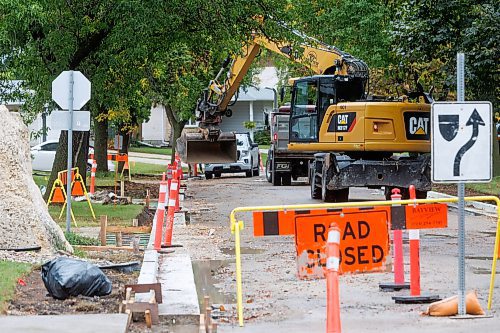 MIKE DEAL / FREE PRESS
Road construction crews work on the stretch of Augusta Drive between Lakeside Drive and Chancellor Drive Tuesday morning.
Reporter: Gabrielle Piche 
240917 - Tuesday, September 17, 2024.