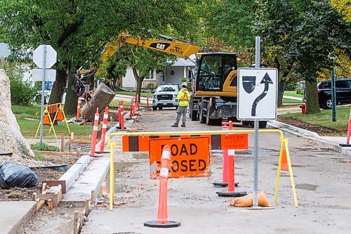 MIKE DEAL / FREE PRESS
Road construction crews work on the stretch of Augusta Drive between Lakeside Drive and Chancellor Drive Tuesday morning.
Reporter: Gabrielle Piche 
240917 - Tuesday, September 17, 2024.