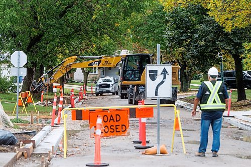 MIKE DEAL / FREE PRESS
Road construction crews work on the stretch of Augusta Drive between Lakeside Drive and Chancellor Drive Tuesday morning.
Reporter: Gabrielle Piche 
240917 - Tuesday, September 17, 2024.