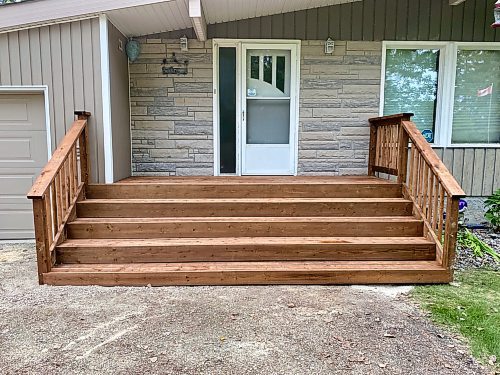 Marc LaBossiere / Winnipeg Free Press

A new treated lumber front access is created using the old slanted concrete steps as support below