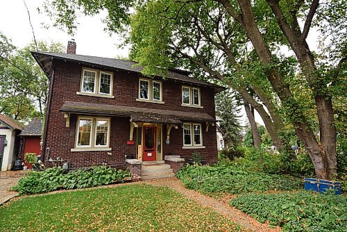 Todd Lewys / Winnipeg Free Press

Situated on a mature, magical riverfront lot, the 2,280 sq. ft., two-and-a-half storey home exudes warmth and character with its timeless brick exterior, red front door and white-trimmed windows.