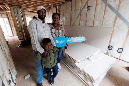 MIKE DEAL / FREE PRESS
Workeabeba Asfaw and her husband Addis Aboye with their son, Eyoab Addis, 5, inside their almost completed home after a ceremony where Habitat for Humanity Manitoba handed over keys to the first fifteen of 55 families that will be living in the Pandora Avenue West development in Transcona. 
Reporter: Aaron Epp
240918 - Wednesday, September 18, 2024.