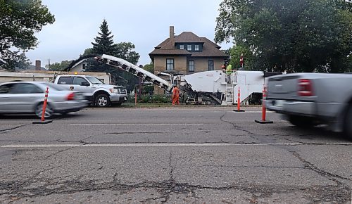 The northbound section of 18th Street becomes a two-way street while a Manitoba road construction crew begins tearing up the southbound lane from the Rosser Avenue intersection on Wednesday afternoon, just in front of the Daly House Museum. (Matt Goerzen/The Brandon Sun)