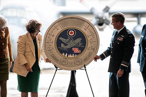 MIKAELA MACKENZIE / WINNIPEG FREE PRESS

Marie Lemay, president and CEO of the Royal Canadian Mint (left), and lieutenant-general Eric Kenny, commander of the Royal Canadian Air Force, reveal a special two&#x2011;dollar circulation coin commemorating the 100th anniversary of the Royal Canadian Air Force on Wednesday, Sept. 18, 2024.

Standup.
Winnipeg Free Press 2024