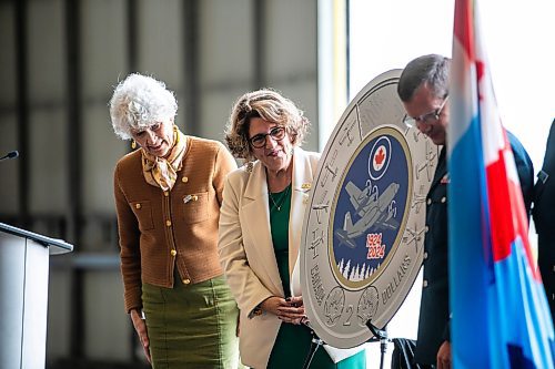 MIKAELA MACKENZIE / WINNIPEG FREE PRESS

Phyllis Clark, chair of the Royal Canadian Mint's board of directors (left), Marie Lemay, president and CEO of the Royal Canadian Mint, and lieutenant-general Eric Kenny, commander of the Royal Canadian Air Force, reveal a special two&#x2011;dollar circulation coin commemorating the 100th anniversary of the Royal Canadian Air Force on Wednesday, Sept. 18, 2024.

Standup.
Winnipeg Free Press 2024