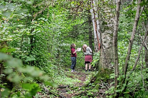 MIKAELA MACKENZIE / WINNIPEG FREE PRESS

Lockport School grade nine students Kasey Forman (left) and Sam Caslake walk the trail at the grand opening of Lord Selkirk School Division&#x573; Albert Beach Trail field trip site on Thursday, Sept. 19, 2024.

For Maggie story.
Winnipeg Free Press 2024