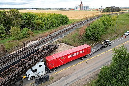 Westbound traffic on Highway 1A was diverted for part of Thursday afternoon after a semi-trailer got stuck under the Kemnay train bridge. No one was hurt in the incident and the truck was towed out from under the bridge. Despite numerous signs warning of the low bridge, it is regularly struck. (Tim Smith/The Brandon Sun)