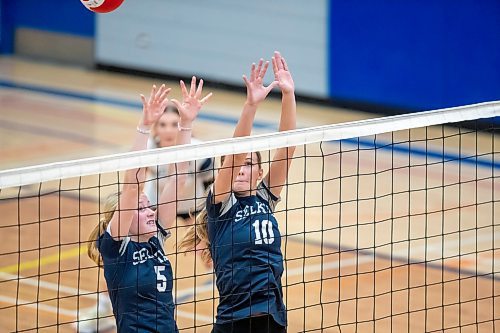 BROOK JONES / FREE PRESS
The Lord Selkirk Royals varsity girls volleyball team earned a victory over the visiting Mennonite Brethren Hawks in three straight sets (25-9, 25-11, 25-12-) in KPAC Tier 1 volleyball action at the Sellkirk Comp in Selkirk, Man., Wednesday, Sept. 18, 2024. Pictured: Selkirk Royals Paige Whiteside (No. 5) and teammate Kennedy Korell (No. 10) attempt to block the volleyball during the second set.