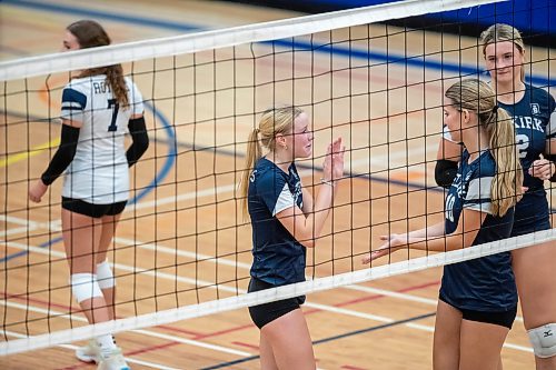 BROOK JONES / FREE PRESS
The Lord Selkirk Royals varsity girls volleyball team earned a victory over the visiting Mennonite Brethren Hawks in three straight sets (25-9, 25-11, 25-12-) in KPAC Tier 1 volleyball action at the Sellkirk Comp in Selkirk, Man., Wednesday, Sept. 18, 2024. Pictured: Selkirk Royals Paige Whiteside (Left) and teammate Kennedy Korell (middle) are about to give each other low fives as teammate Brookly Grobb-Prins (right) looks on.