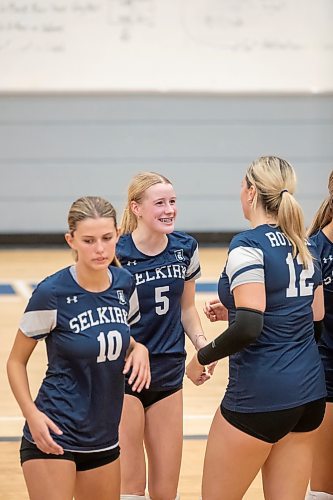 BROOK JONES / FREE PRESS
The Lord Selkirk Royals varsity girls volleyball team earned a victory over the visiting Mennonite Brethren Hawks in three straight sets (25-9, 25-11, 25-12-) in KPAC Tier 1 volleyball action at the Sellkirk Comp in Selkirk, Man., Wednesday, Sept. 18, 2024. Pictured: Selkirk Royals Paige Whiteside (No. 5) smiles as she looks at teammate Brooklyn Grobb-Prins (No. 12) during the third set.