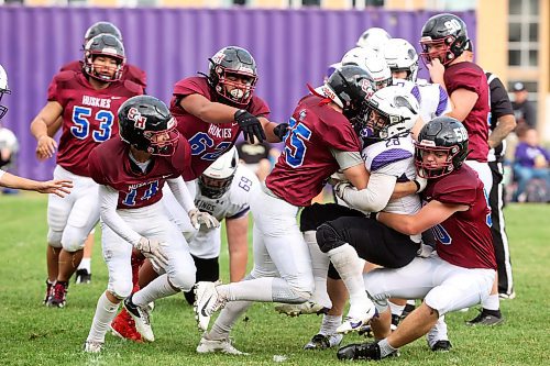 19092024
Brayden Smith #28 of the Vincent Massey Vikings is tackled with the ball during high school football action against the Coll&#xe8;ge Sturgeon Heights Collegiate Huskies at VMHS on Thursday afternoon.
(Tim Smith/The Brandon Sun)