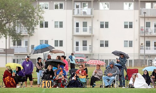 19092024
Football fans brave light showers while watching the Vincent Massey Vikings take on the Coll&#xe8;ge Sturgeon Heights Collegiate Huskies at VMHS on Thursday afternoon.
(Tim Smith/The Brandon Sun)