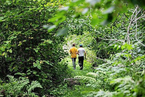 MIKAELA MACKENZIE / WINNIPEG FREE PRESS

Lockport School grade nine students Logan Fiebelkorn (left) and Wyatt Olson walk the trail at the grand opening of Lord Selkirk School Division&#x573; Albert Beach Trail field trip site on Thursday, Sept. 19, 2024.

For Maggie story.
Winnipeg Free Press 2024