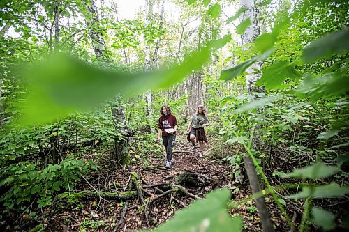 MIKAELA MACKENZIE / WINNIPEG FREE PRESS

Lockport School grade nine students Kasey Forman (left) and Sam Caslake walk the trail at the grand opening of Lord Selkirk School Division&#x573; Albert Beach Trail field trip site on Thursday, Sept. 19, 2024.

For Maggie story.
Winnipeg Free Press 2024