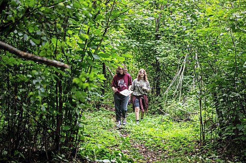 MIKAELA MACKENZIE / WINNIPEG FREE PRESS

Lockport School grade nine students Kasey Forman (left) and Sam Caslake walk the trail at the grand opening of Lord Selkirk School Division&#x573; Albert Beach Trail field trip site on Thursday, Sept. 19, 2024.

For Maggie story.
Winnipeg Free Press 2024