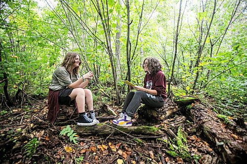 MIKAELA MACKENZIE / WINNIPEG FREE PRESS

Lockport School grade nine students Sam Caslake (left) and Kasey Forman explore the trail at the grand opening of Lord Selkirk School Division&#x573; Albert Beach Trail field trip site on Thursday, Sept. 19, 2024.

For Maggie story.
Winnipeg Free Press 2024