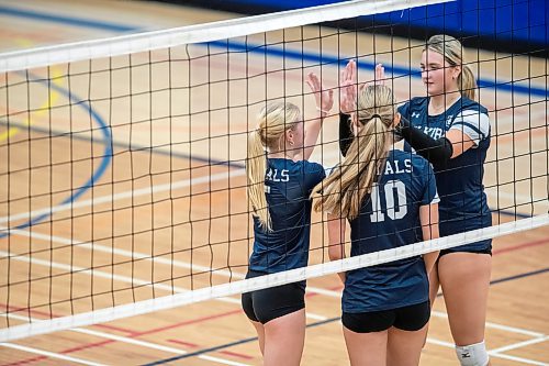 BROOK JONES / FREE PRESS
The Lord Selkirk Royals varsity girls volleyball team earned a victory over the visiting Mennonite Brethren Hawks in three straight sets (25-9, 25-11, 25-12-) in KPAC Tier 1 volleyball action at the Sellkirk Comp in Selkirk, Man., Wednesday, Sept. 18, 2024. Pictured: Selkirk Royals Paige Whiteside (Left) and teammate Brookly Grobb-Prins (right) give each other high fives as teammate Kennedy Korell (middle) during the second set.