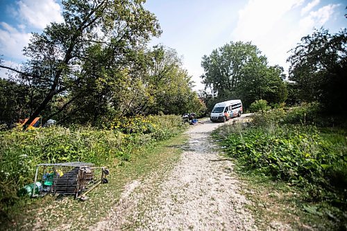 MIKAELA MACKENZIE / WINNIPEG FREE PRESS

A Main Street Project van makes its way down to an encampment where a police car hit a woman, who later died from her injuries, at Fort Rouge Park on Tuesday, Sept. 3, 2024. 

For Nicole story.
Winnipeg Free Press 2024