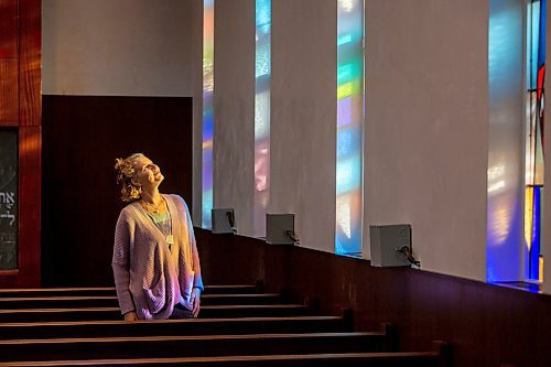 BROOK JONES / FREE PRESS
Congregation Shaarey Zedek in Winnipeg, Man., has undergone renovations that include the refurbishment of the stained glass windows created by Leo Mol in the Rabbie Louis Berkal Chapel for when the building opened in 1949. Pictured: Leslie Emery who was ordained a cantor in June of 2023 looks up at the stained glass windows during the evening of Thursday, Sept. 19, 2024.