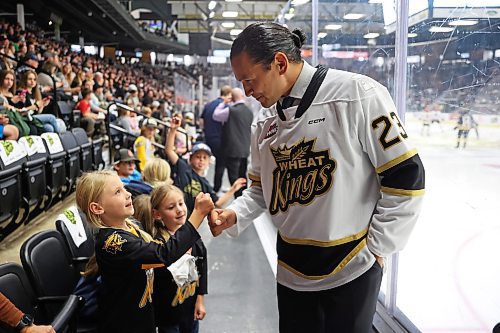 Manitoba Premier Wab Kinew meets fans after taking part in the ceremonial puck-drop at the Brandon Wheat Kings home-opener against the Moose Jaw Warriors at Westoba Place on Friday evening. (Tim Smith/The Brandon Sun)