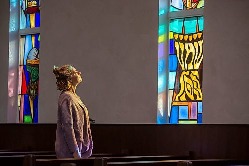 BROOK JONES / FREE PRESS
Congregation Shaarey Zedek in Winnipeg, Man., has undergone renovations that include the refurbishment of the stained glass windows created by Leo Mol in the Rabbie Louis Berkal Chapel for when the building opened in 1949. Pictured: Leslie Emery who was ordained a cantor in June of 2023 looks up at the stained glass windows during the evening of Thursday, Sept. 19, 2024.