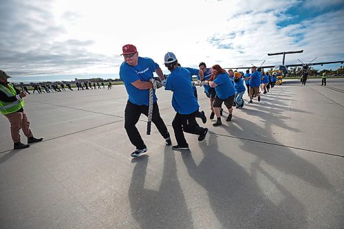 Ruth Bonneville / Free Press

Standup  -  Plane Pull

Photo of the Boeing personal as they give it all they have as they pull an Airbus CC-330 Husky plane along the 17 Wing tarmac during the Plane Pull Friday. 


17 Wing Winnipeg hosts GCWCC Plane Pull Friday featuring 21 teams with 25 people in each team.  
        
The GCWCC Plane Pull is a charitable event held in support of United Way Winnipeg, where representatives from United Way, members of 17 Wing Winnipeg, and teams from the local community compete in timed pulls of military aircraft and equipment.


Sept 20th,  2024L