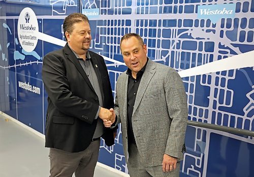 20092024
Ian Bushie, Minister of Municipal and Northern Relations as well as Minister of Indigenous Economic Development, shakes hands with Brandon Wheat Kings owner Jared Jacobson after the ribbon cutting for the unveiling of the newly renovated Westoba Place arena on Friday evening. 
(Tim Smith/The Brandon Sun)