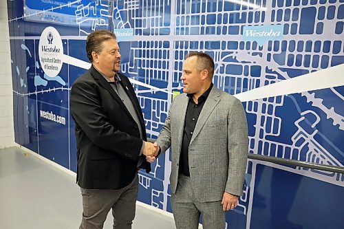 20092024
Ian Bushie, Minister of Municipal and Northern Relations as well as Minister of Indigenous Economic Development, shakes hands with Brandon Wheat Kings owner Jared Jacobson after the ribbon cutting for the unveiling of the newly renovated Westoba Place arena on Friday evening. 
(Tim Smith/The Brandon Sun)