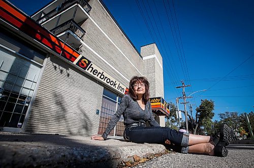 JOHN WOODS / FREE PRESS
Michelle Dore, a resident of the Sherbrook Inn, is photographed outside the hotel Sunday, September 22, 2024. Dore and other residents are being evicted from the hotel by the new owner.

Reporter: malak