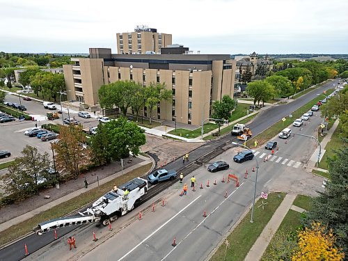 Paving work continues on 18th Street at Louise Avenue in Brandon on Monday. Scheduled to wrap up sometime in October, the province is spending $9.7 million on rebuilding almost three kilometres of 18th Street — part of Highway 10 — between Aberdeen and Rosser avenues. (Tim Smith/The Brandon Sun)