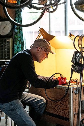 MIKAELA MACKENZIE / WINNIPEG FREE PRESS
	
Jeff Nelson, who makes wooden pipes for pot smokers, works in his garage workshop on Monday, Sept. 23, 2024. 

For AV story.
Winnipeg Free Press 2024