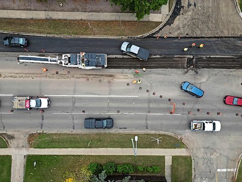 23092024
Paving work continues on 18th Street at Louise Avenue in Brandon on Monday. 
(Tim Smith/The Brandon Sun)