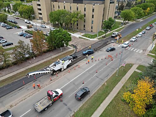 23092024
Paving work continues on 18th Street at Louise Avenue in Brandon on Monday. 
(Tim Smith/The Brandon Sun)