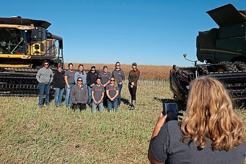 Photos are taken of the volunteer women operating combines, grain carts and grain trucks during the fourth annual Acres for Hamiota community harvest west of Hamiota on Tuesday. Acres for Hamiota raises money for community projects and organizations and this year all the machinery for the harvest was operated by women to highlight the important role women play in agriculture. The harvest was preceded by a picnic lunch. (Tim Smith/The Brandon Sun)