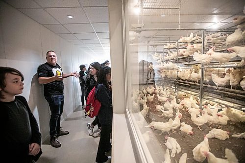 MIKAELA MACKENZIE / WINNIPEG FREE PRESS
	
Harley Siemens talks to students about chickens at the egg station in the Amazing Agriculture Adventure (a four-day event immersing Manitoba students into the world of agriculture) at the Bruce D. Campbell Farm &amp; Food Discovery Centre on Tuesday, Sept. 24, 2024. 

For Aaron Epp story.
Winnipeg Free Press 2024