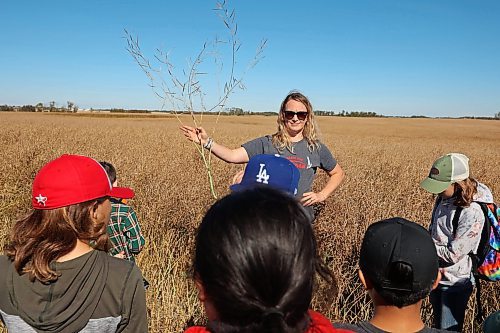 05092024
Farmer Laura Cowling talks to Hamiota Elementary School grade 4-5 students about canola during the fourth annual Acres for Hamiota community harvest west of Hamiota on a sunny Tuesday. Acres for Hamiota raises money for community projects and organizations and this year all the machinery for the harvest was operated by women to highlight the important role women play in agriculture. The harvest was preceded by a picnic lunch.
Tim Smith/The Brandon Sun) 