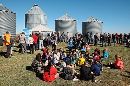 05092024
Farmers, area residents and other visitors including students from Hamiota Elementary School enjoy a picnic lunch during the fourth annual Acres for Hamiota community harvest west of Hamiota on a sunny Tuesday. Acres for Hamiota raises money for community projects and organizations and this year all the machinery for the harvest was operated by women to highlight the important role women play in agriculture. 
(Tim Smith/The Brandon Sun)