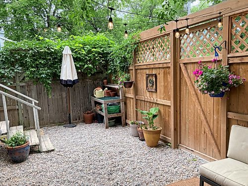 Shannon Bahuad / Winnipeg Free Press
A lattice-topped wooden fence with a barn door style gate enclose this backyard entertainment area which has a permeable pea gravel surface.