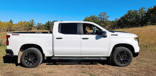 The passenger side of Westman’s Alberto Dallari's 2022 white Chevrolet Silverado Trail Boss crew cab. Dallari has muscular dystrophy and is unable to walk, but he drives his modified truck using customized hand controls and a ball-shaped knob on the steering wheel. (Michele McDougall/The Brandon Sun)
