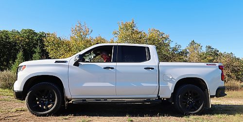 The  passenger side of Westman’s Alberto Dallari's 2022 white Chevrolet Silverado Trail Boss crew cab. Dallari has muscular dystrophy and is unable to walk, but he drives his modified truck using customized hand controls and a ball-shaped knob on the steering wheel. (Michele McDougall/The Brandon Sun)
