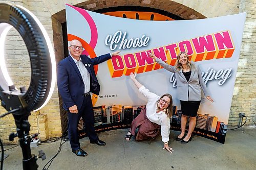 MIKE DEAL / FREE PRESS
Winnipeg Mayor Scott Gillingham, Kate Fenske CEO of Downtown Winnipeg BIZ, and Amelia Laidlaw chair of Downtown Winnipeg BIZ during the launch of the BIZ&#x2019;s new marketing campaign at The Forks Wednesday morning. 
Reporter: Gabrielle Piche 
240925 - Wednesday, September 25, 2024.