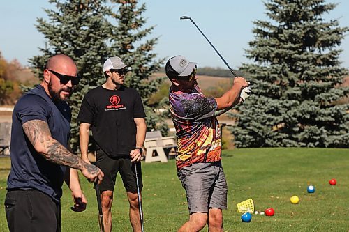 25092024
Alex Borges, Kelvin Pople and Derek Smart practice their swings at Mulligan's Driving Range &amp; Practice Centre along Highway 1A just outside Brandon on a beautiful late September Wednesday.
(Tim Smith/The Brandon Sun)